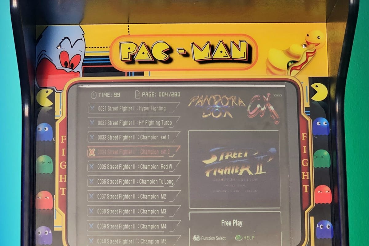 Retro arcade game cabinet at a modern wedding venue